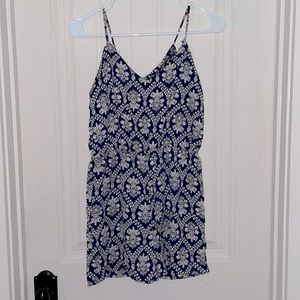 honey punch blue with white design romper with an open tie back size women’s XS